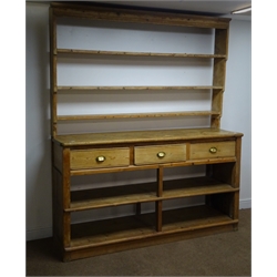  19th century pine dresser, three shelf plate rack, three drawers, square supports joined by an undertier with two shelves, plinth base, W188cm, H221cm, D55cm  