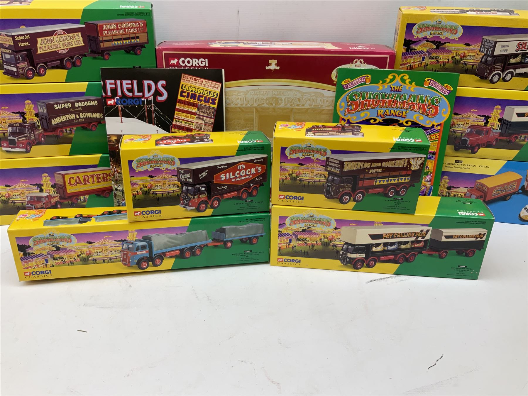 Corgi Showman's Range - thirteen die-cast models comprising 06601, 09901, 12601, 15901, 16101, 16501, 16502, 21701, 24401, 24801, 27602, 27801 and 31012 (Boxing Set); together with Corgi Classics No.31702 ERF Box Van, Showman's Caravan and VW Van; all boxed (14)