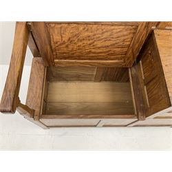 'Acornman' figured oak telephone table, panelled back above hinged seat and two drawers, panelled sides and front, all over adzing, by Alan Grainger of Brandsby, York