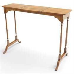 Edwardian mahogany reading stand, rectangular adjustable book rest with hinged ledge, flanked by rectangular side shelves, on slender turned twin end supports with splayed feet