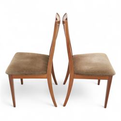 G Plan - mid-20th century teak extending dining table, oval top with integrated extension leaf, raised on tapering legs, together with a set of six slat back dining chairs including two carvers, upholstered in dark green velour (Extends to 210cm)