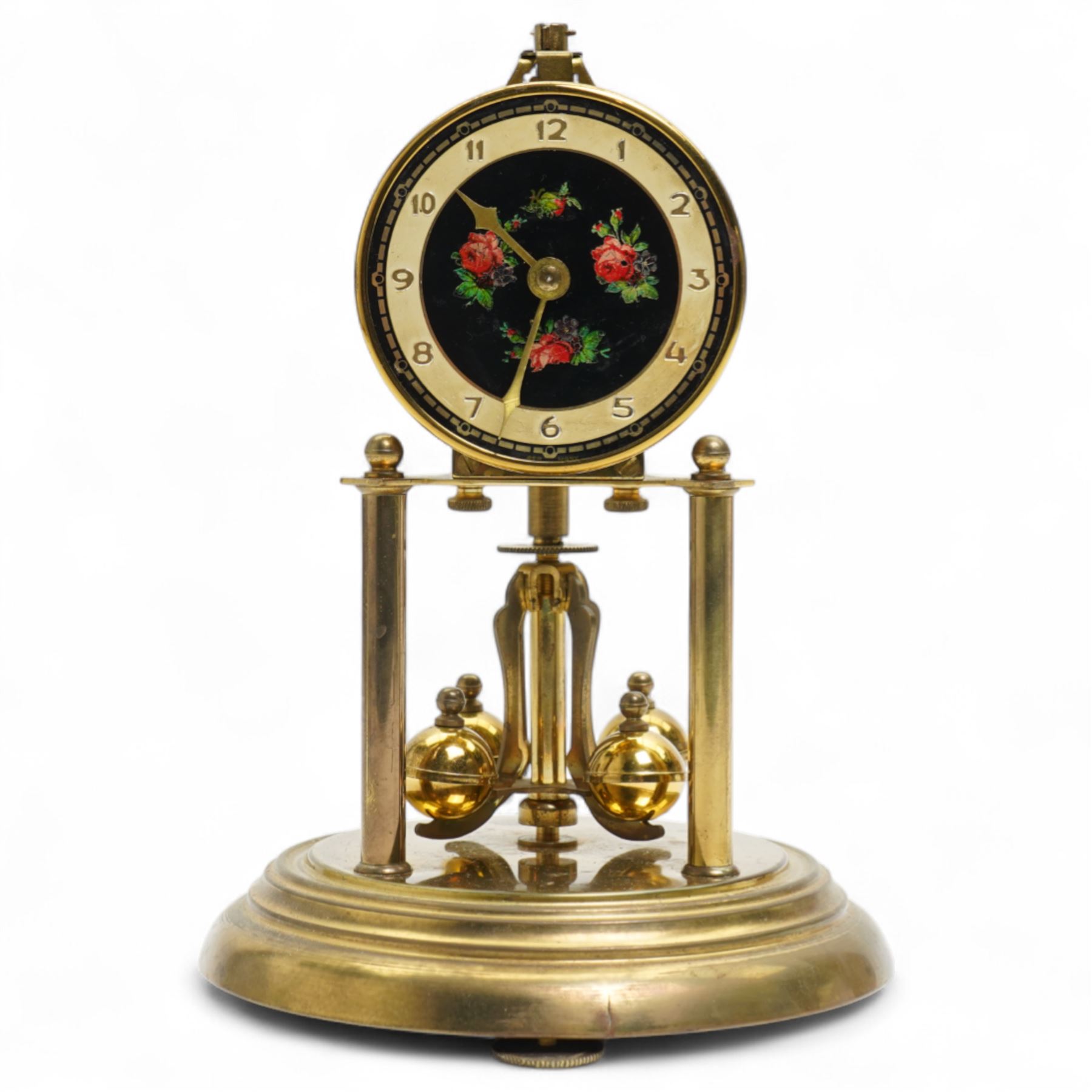 1960’s torsion clock with a skeleton movement and four ball oscillating pendulum, with a glass dome