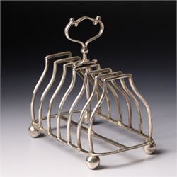 Edwardian silver six division toast rack with loop handle and ball feet Sheffield 1908 Maker Martin Hall & Co