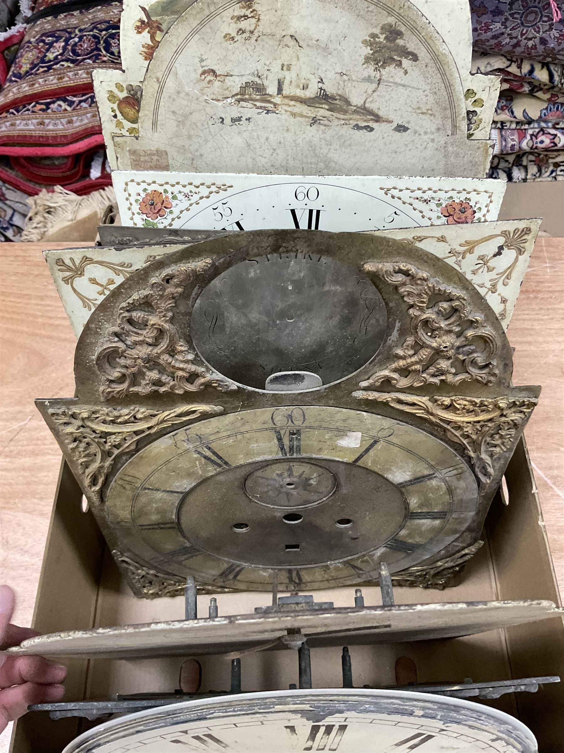 Approximately twenty-two longcase and wall clock dials, 18th century and later, included painted and brass examples
