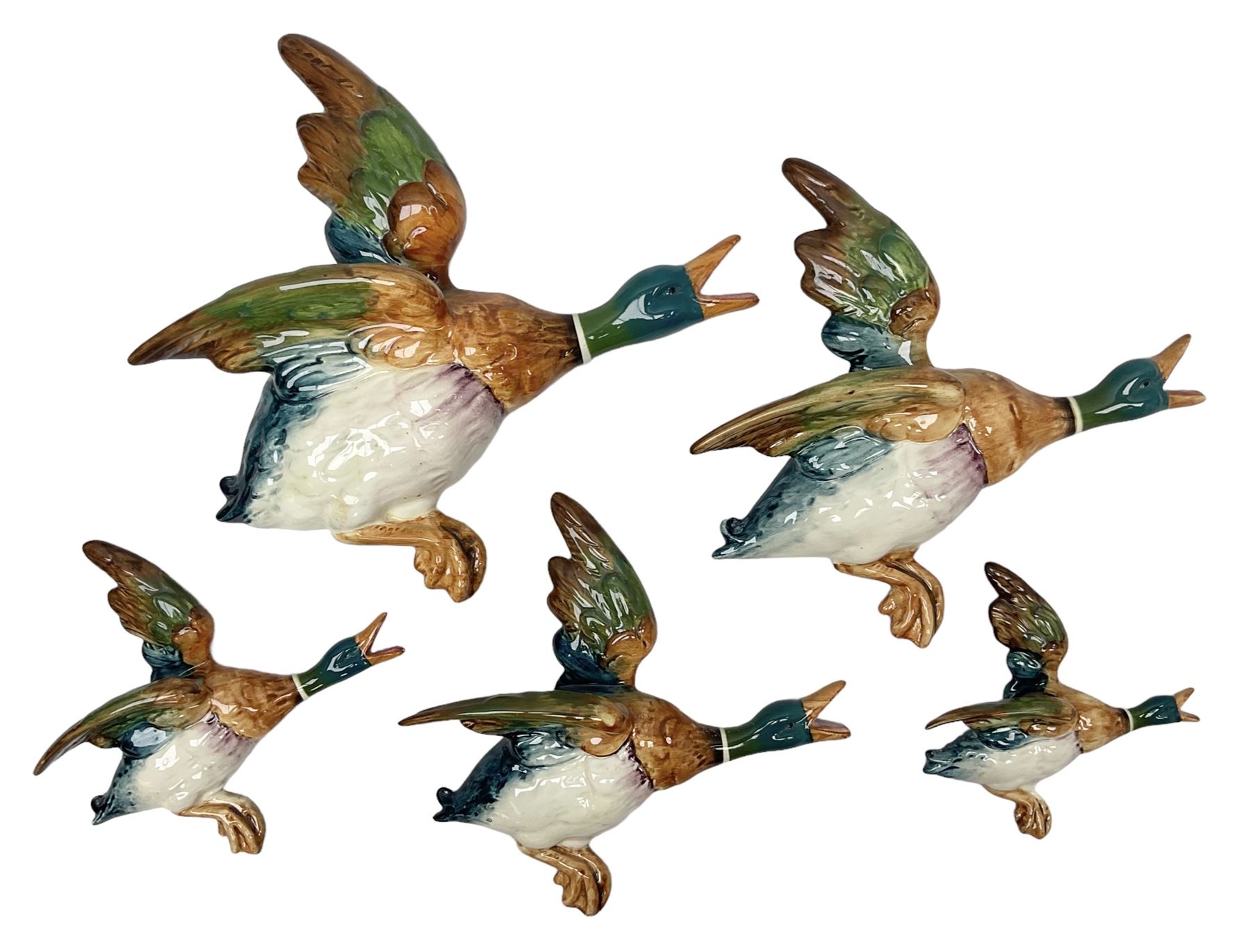 Set of five Beswick graduated wall mounting figures of flying ducks, models from 596/0 to 596/4, largest L29cm