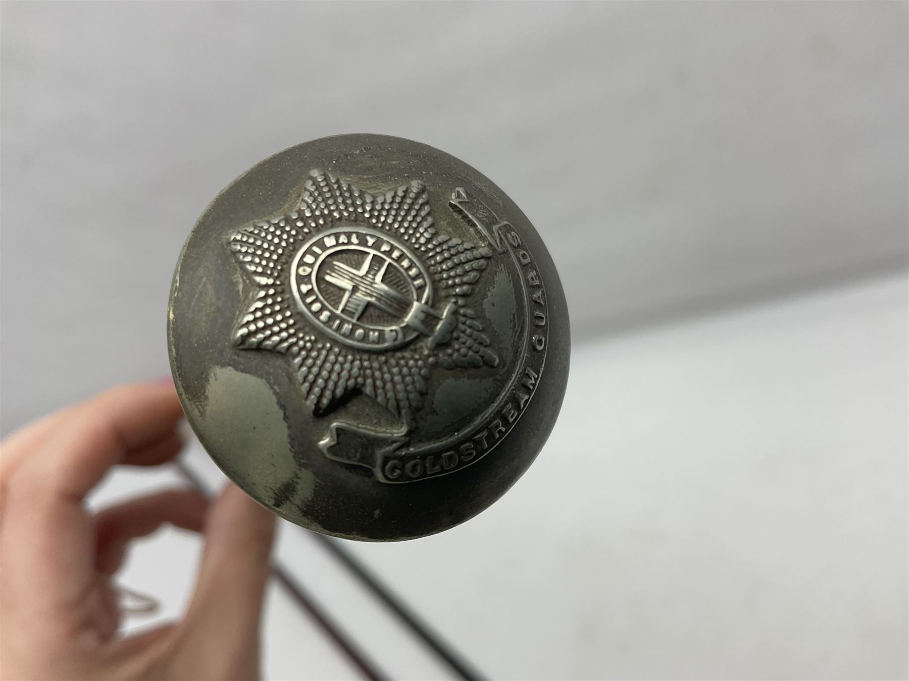 Three parade ground canes - malacca cane Coldstream Guards with plated mount engraved 'H.A. Myhan' L87cm; ebonised Church Lads Brigade 'Fight The Good Fight'; and mahogany stained Worcestershire Regiment (3)