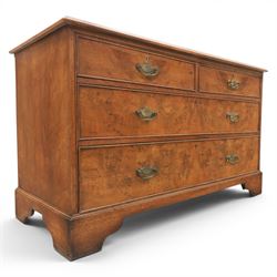 Traditional design walnut inlaid chest, with figured top with circular inlay and crossbanded top with moulded edge, figured drawers with cockbeaded edges and brass handles, raised on bracket feet