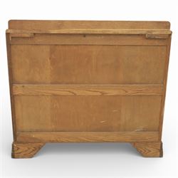 Early 20th century Art Deco bedroom suite, comprising double wardrobe, dressing table and chest of drawers, constructed in walnut with figured veneers and geometric banding, the wardrobe with arched top and panelled doors enclosing a fitted interior, the dressing table with rectangular top below a three panel mirror arrangement, fitted with two short over two long drawers, the chest with three short and three long drawers, each piece fitted with faceted handles and raised on shaped feet
Wardrobe (H 177cm, D 46cm, W 112cm)
Chest (H 85cm, D 48cm, W 92cm)
Dressing table (H 160cm, D 52cm, W 106cm)
