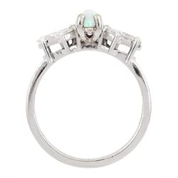 White gold opal and diamond cluster ring, the central opal set with three marquise cut diamonds either side, stamped 14K, total diamond weight approx 0.65 carat
