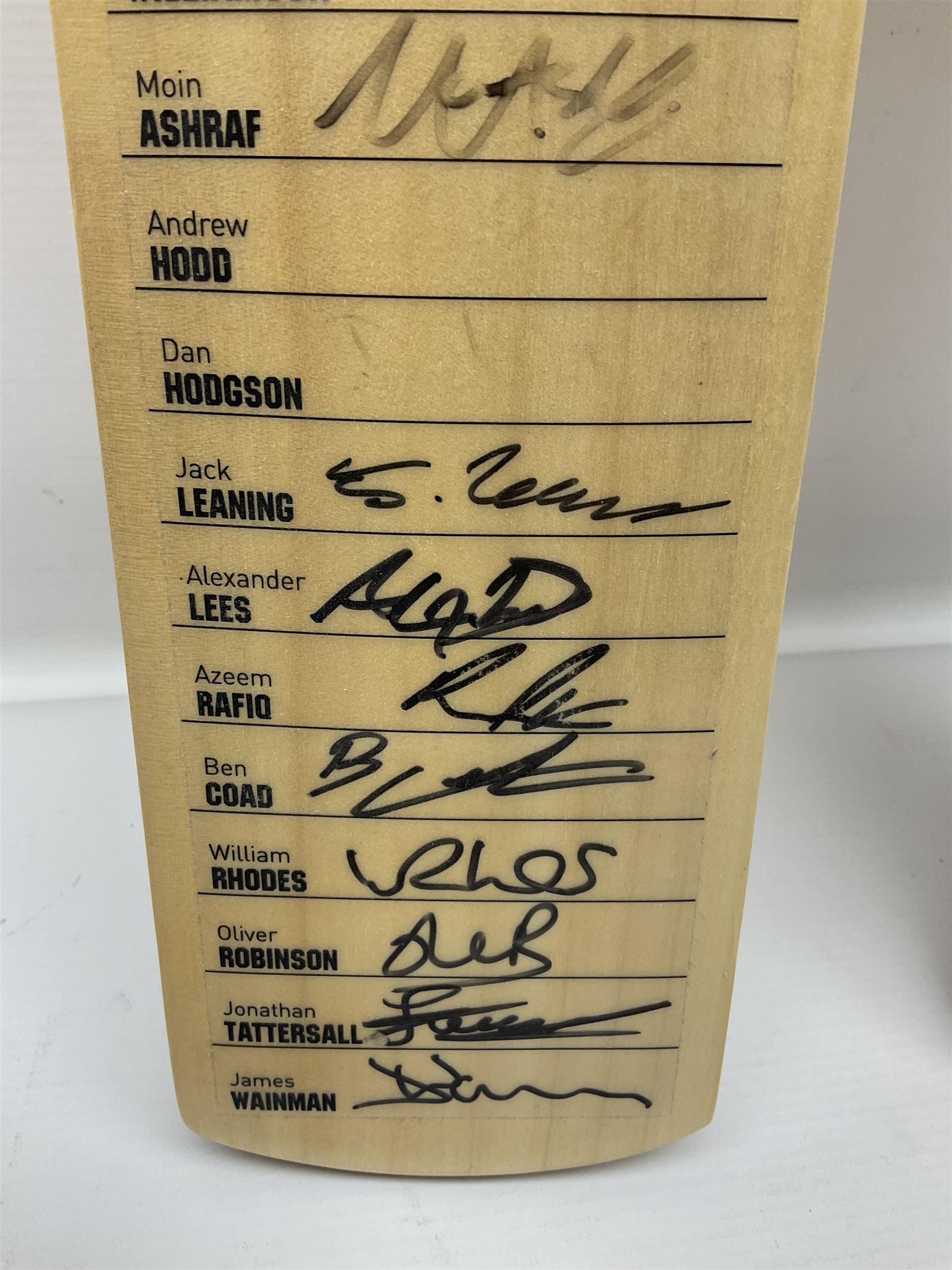 Two signed Yorkshire County cricket bats, from 2013 and 2014 seasons, bearing signatures including Johnny Bairstow, Joe Root, Tim Bresnan, Andrew Gale, etc