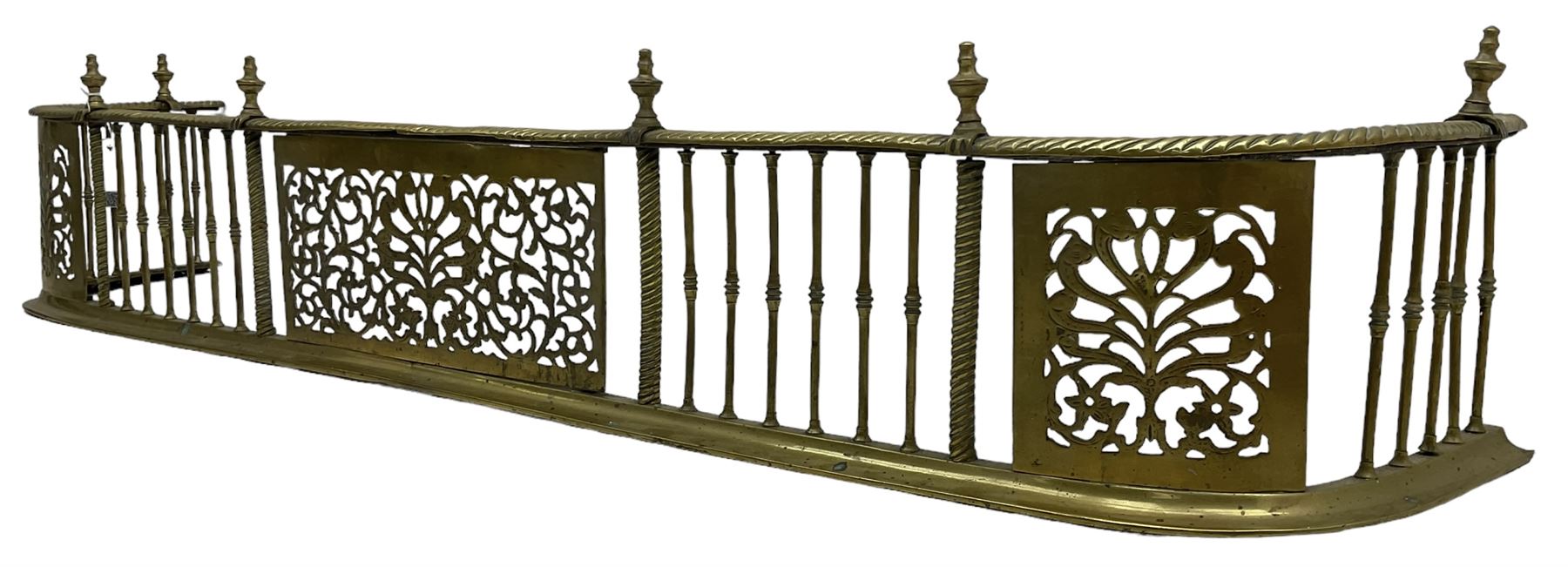 Early 19th century Irish brass D-shaped brass fender, twist borders and balustrade supports, central pierced frieze panel decorated with scrolling foliage and central anthemion motif  