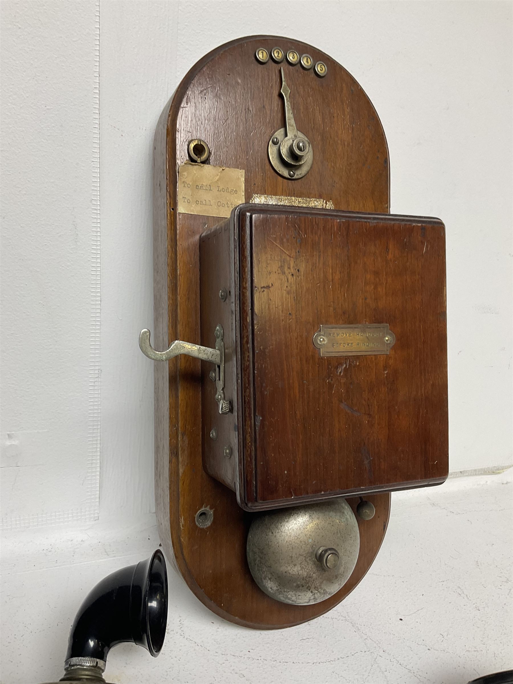 Two Hunningscone patent wall mounting telephones in walnut casing, together with Sterling Telephone & Electric Co. Ltd early wall-mounted telephone 'Primax' and one other 