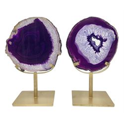 Pair of purple agate slices, polished with rough edges, raised upon gilt metal stands