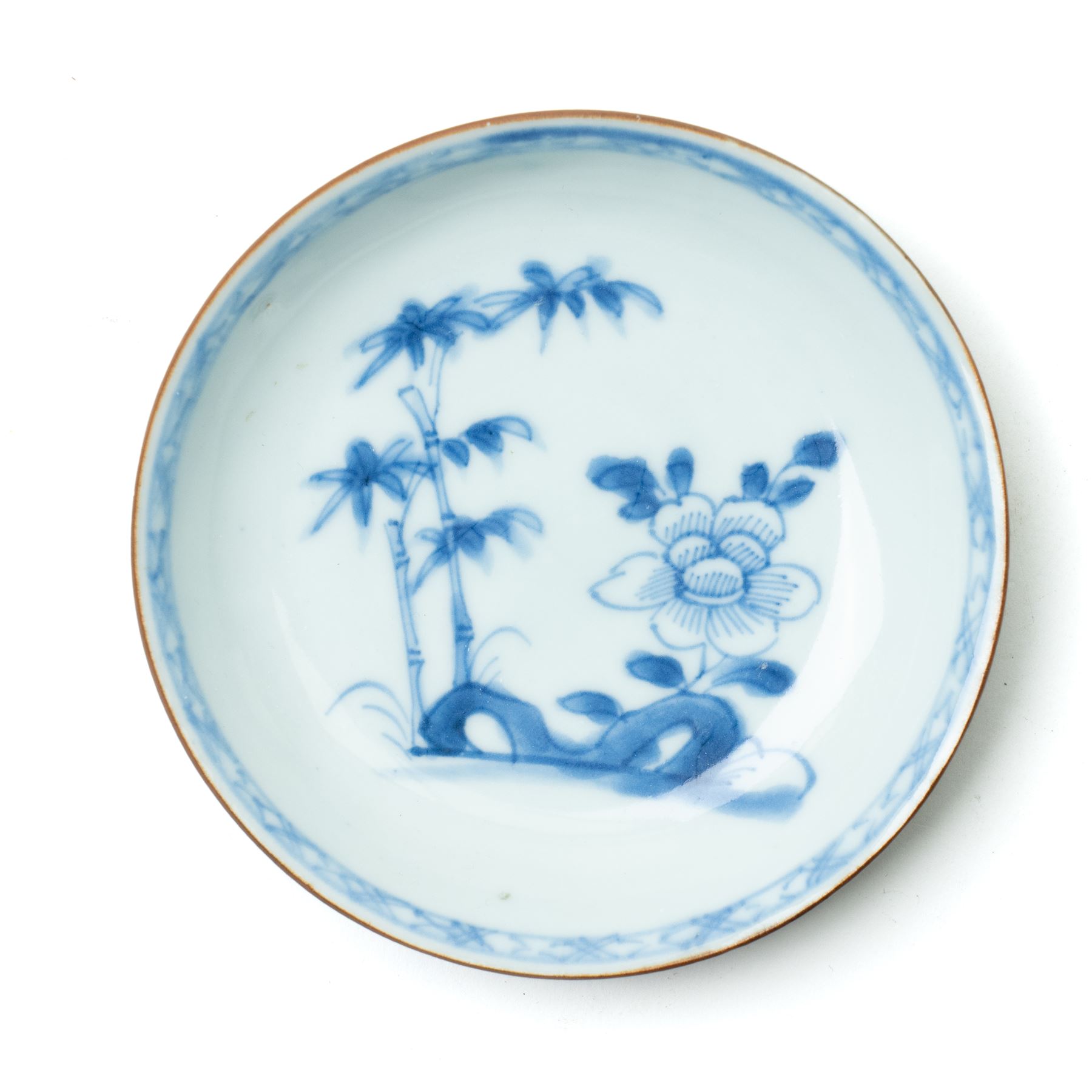 Pair of 18th century Chinese blue and white ‘Nanking Cargo’ saucer dishes painted with bamboo and peony, with Christie's lot label No 5258 D11.5cm