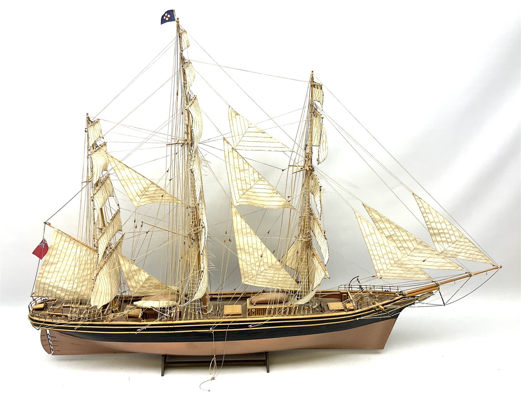 Three masted kit built sailing ship with cloth sales, deck fittings and full rigging, on open display, L110cm, H80cm  