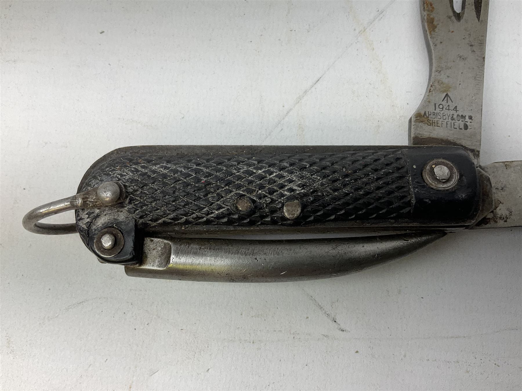 WW2 British army folding jack/clasp knife, the blade marked A.H. Bisby & Co Ltd Sheffield with broad arrow and date 1944, marlin spike and can opener; and British Navy seaman's rope pocket knife, the blade marked Venture H.M. Slater Sheffield (2)