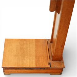 Early 20th century French oak height and balance scales, with graduated vertical rule, adjustable counterweight mechanism with brass and steel fittings, raised on a stepped rectangular oak base, bearing brass maker’s plaque, signed Kuhn & Fleichel, Jarville