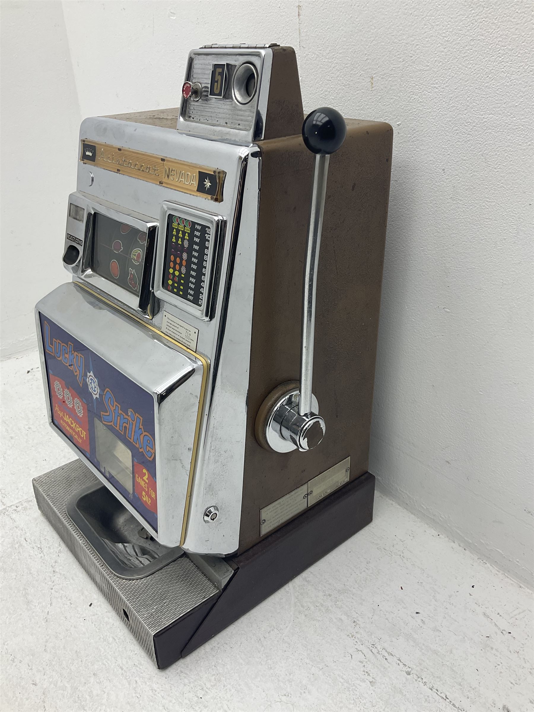 Aristocrat Nevada Lucky Strike one-armed bandit arcade machine, circa 1964, light-up display in aluminium and stainless steel case, with keys, H72cm 