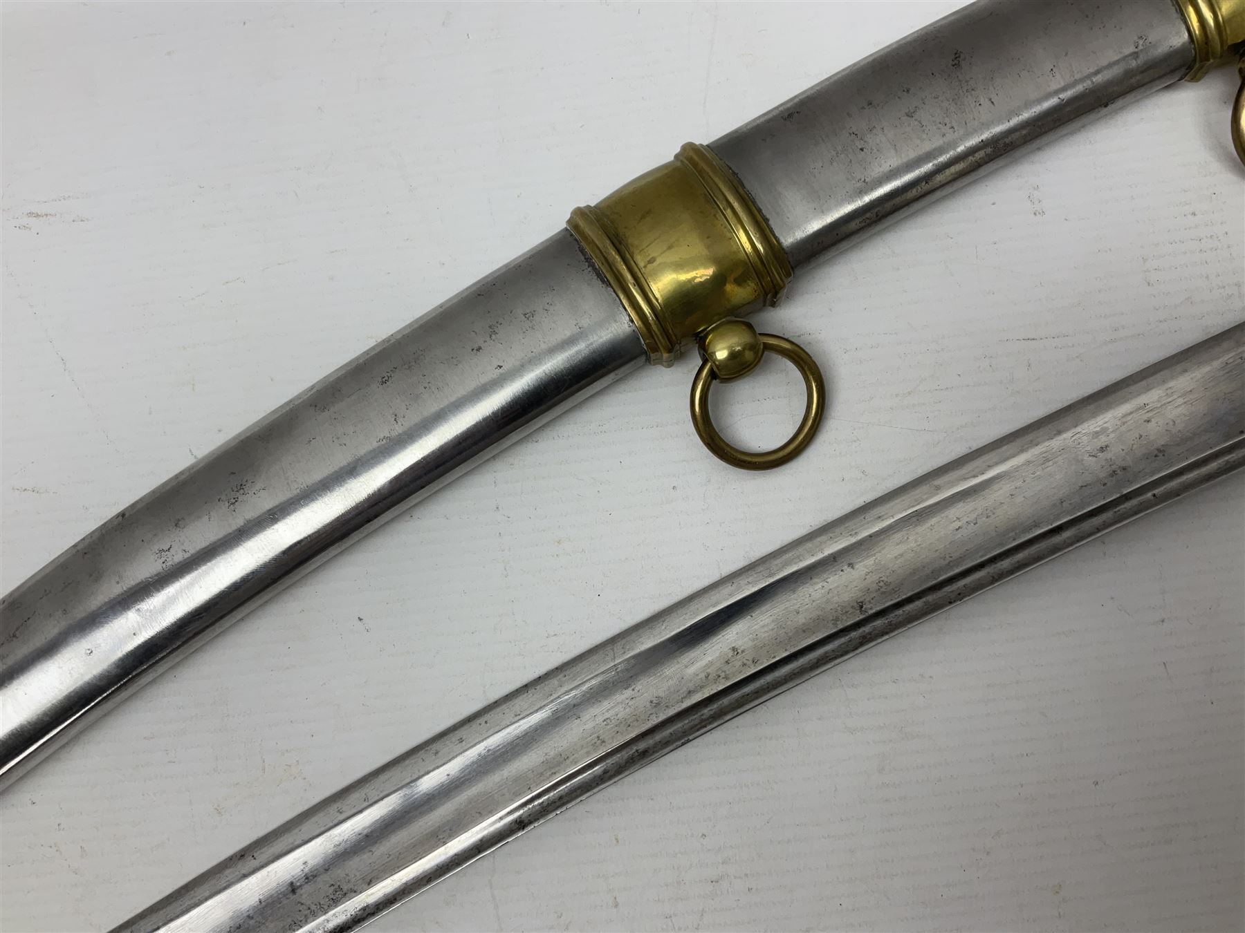 19th century French Chasseur a Cheval de la Guard trooper's sword with 86.5cm slightly curving fullered blade, brass three-bar hilt with elongated elliptical langets and wire-bound leather grip; in polished steel scabbard with two brass suspension rings L104cm overall