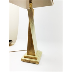 A two tone gilt table lamp, with twisted stem upon a square stepped base, supporting a conforming square tapering shade, overall H73cm. 
