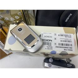 Kundo quartz clock, miniature brass clocks, two barometers, Sony digital camera, Nokia phone, Monarch Remington typewriter, commemorative Shilling etc