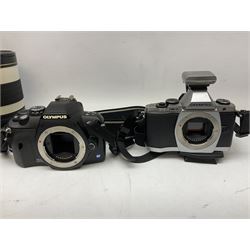 Three Olympus Camera bodies, comprising of OM-D E-M5, E-400 and E-450,   together with 'Samyang Mirror Lens 800mm 1:8.0DX', Olympus 'Zuiko Digital 40-150mm 1;3.5-4.5mm' lens, three other lenses and Velbon CX444 tripod 