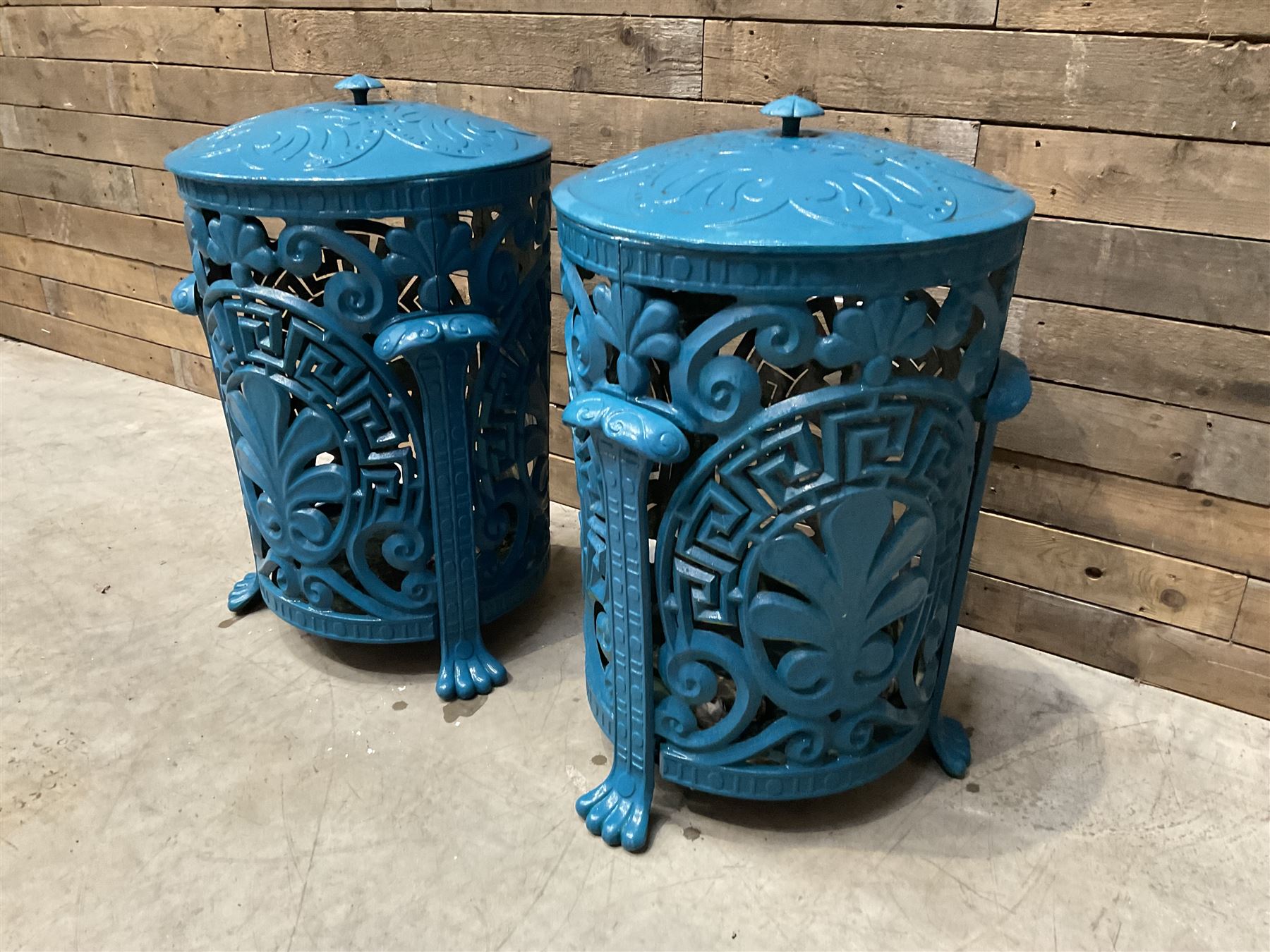 Pair of blue painted cast iron garden bins