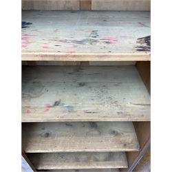 The North of England School Furnishing Company Limited Darlington - early 20th century oak school cupboard, projecting moulded cornice over two panelled doors, fitted with shelves, on chamfered plinth base 