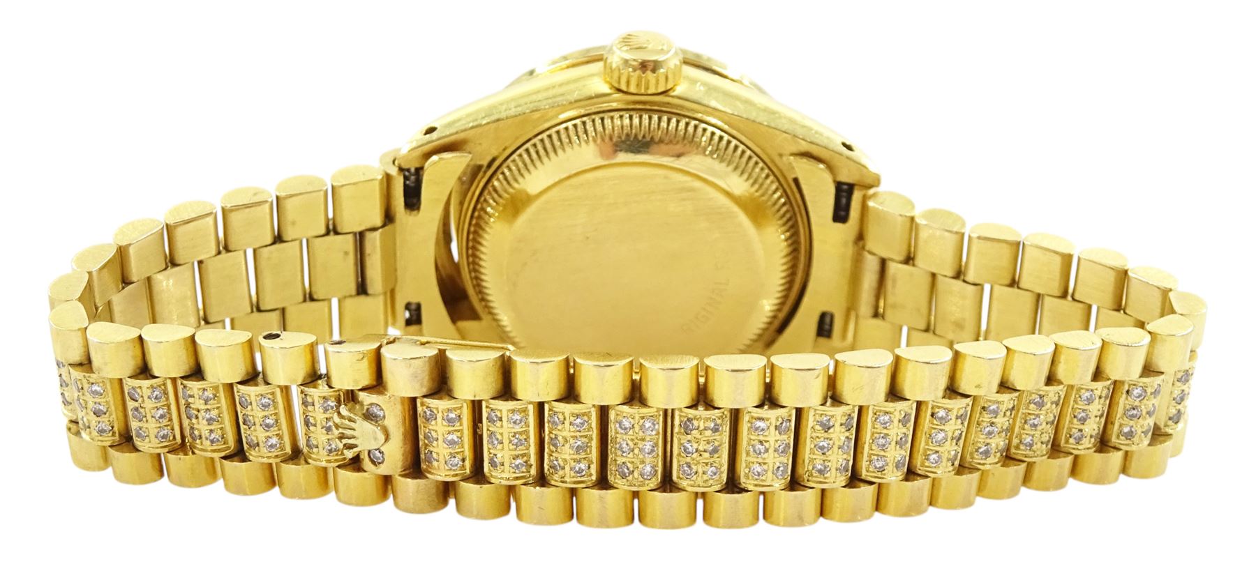 Rolex Oyster Perpetual Datejust ladies 18ct gold automatic wristwatch, circa 1983, Ref. 69178, serial No. 8058240, champagne dial diamond dot hour markers and outer diamond ring, after market diamond set bezel and lugs, on 18ct gold President bracelet, set with after market diamonds, with AIGL report and additional links