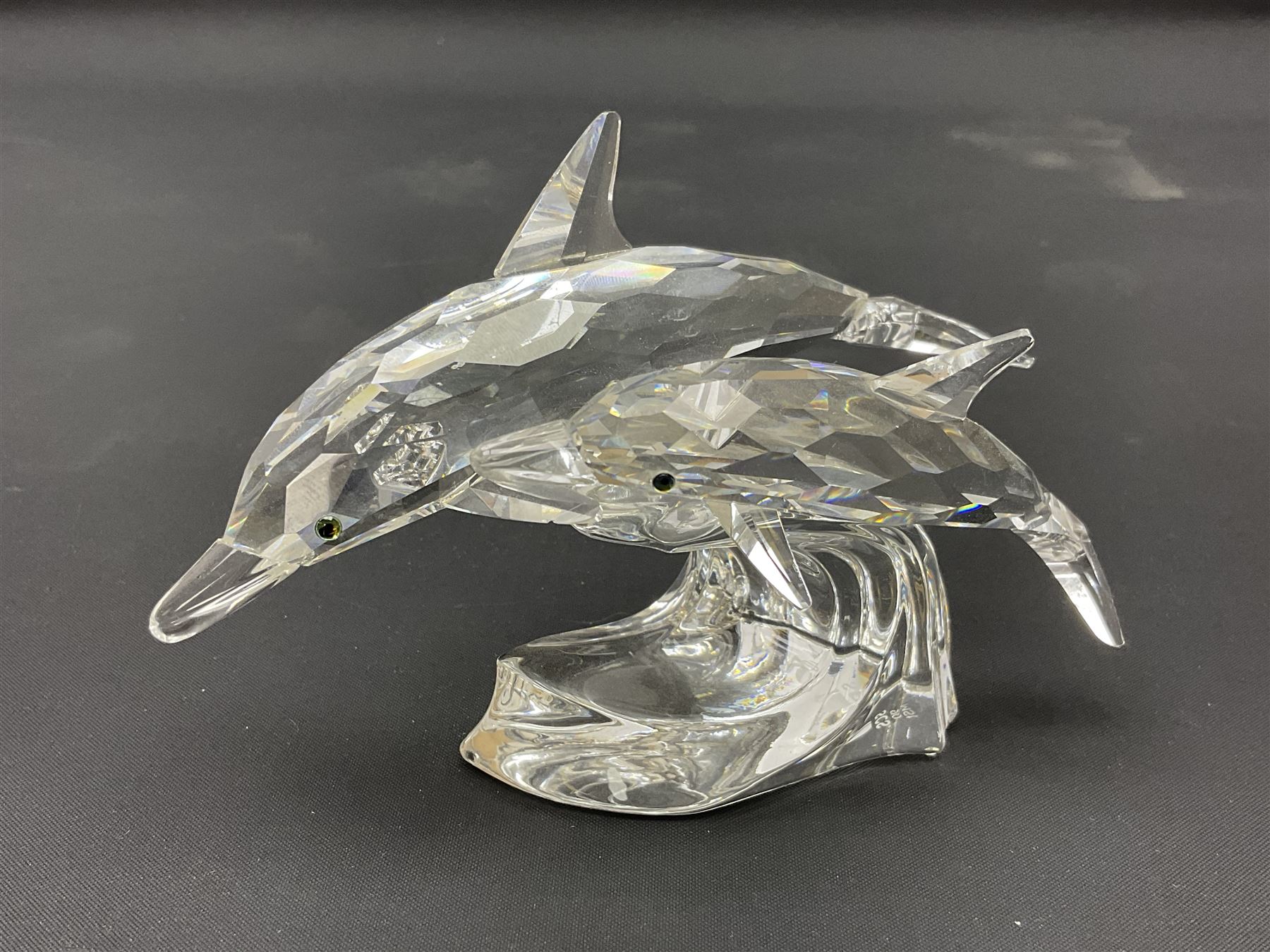 Nineteen Swarovski Crystal sea creatures, to include dolphins, seals, puffer fish, octopus, crabs, together with a quantity Swarovski Crystal shells 