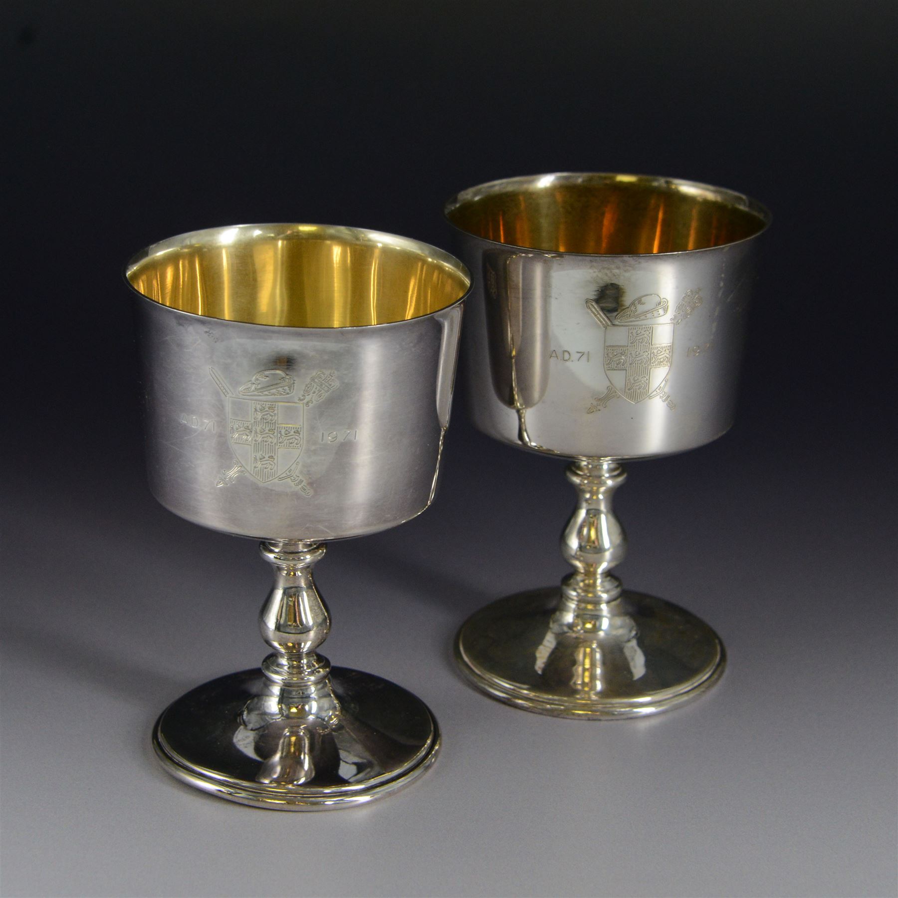 Pair of limited edition silver goblets, commemorating the 1900th  founding of the city of York by, the plain bowl with gilt interior and engraved with York crest dated AD71-1971, upon knopped stem and circular domed foot, hallmarked Barker Ellis Silver Co, Birmingham 1970, H11cm