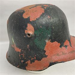 Three battlefield relic helmet shells - WWI German M16; WWI French Adrian; and WWII British (3)