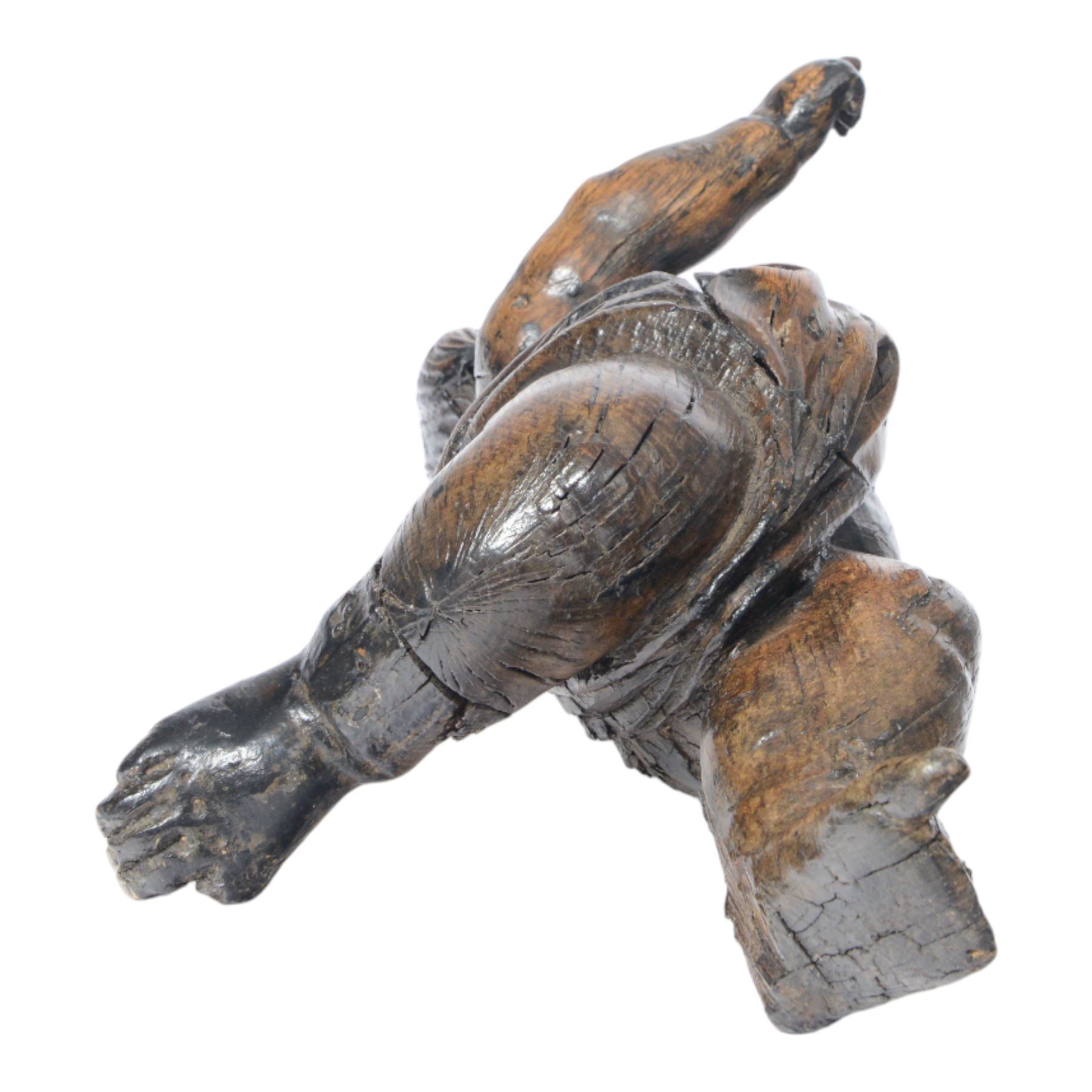 17th century carved figure of a putto, modelled with arms upstretched and head turned, approximately H64cm W23cm D27cm