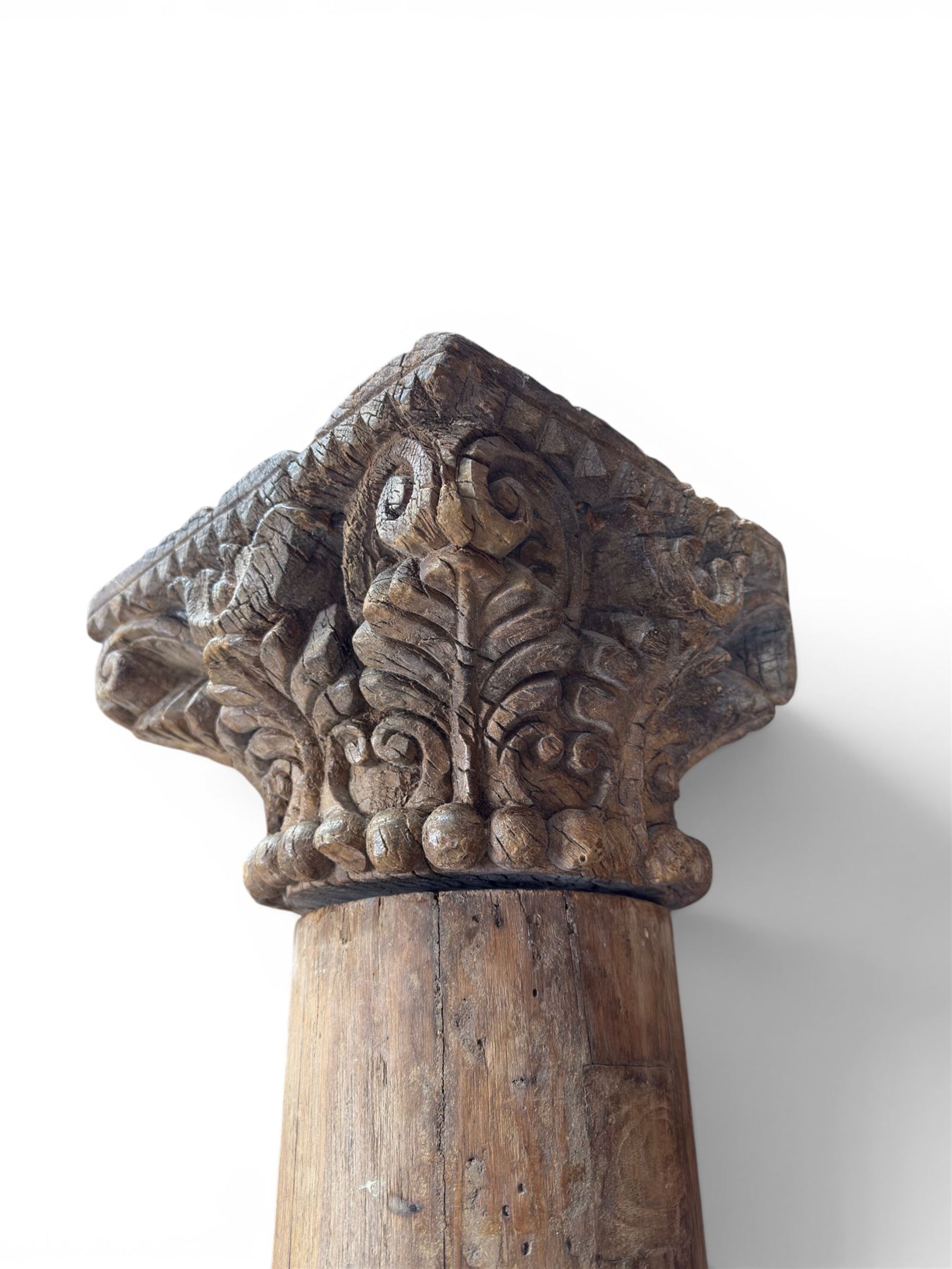 Matched pair of 19th century hardwood architectural columns with carved capitols, column diameter 18cm