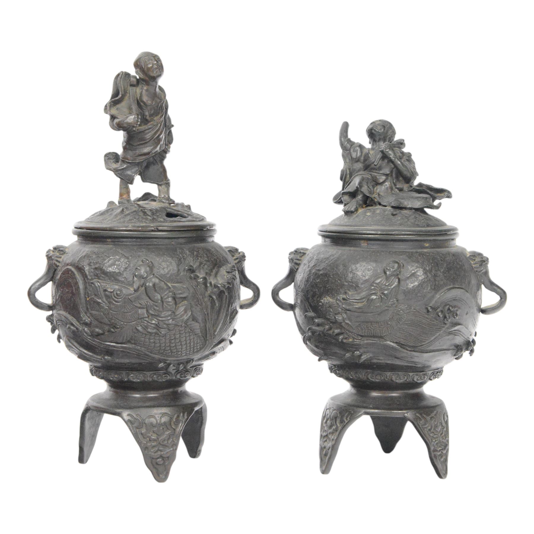 Pair of Japanese bronze koro, raised upon three feet, he body of the koro decorated with figures and animals, the cover mounted with figures, H24cm