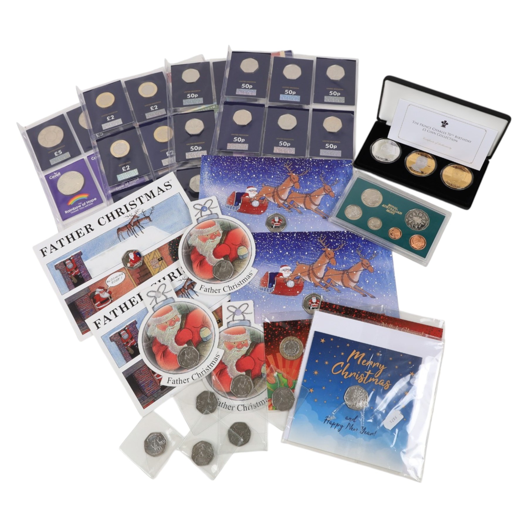 Mostly commemorative coins, including Queen Elizabeth II two pound and fifty pence coins on Change Checker cards, 'Prince Charles 70th Birthday Coin collection', etc