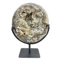 Large agate geode with quartz crystals to the centre, upon a metal stand, H35cm 