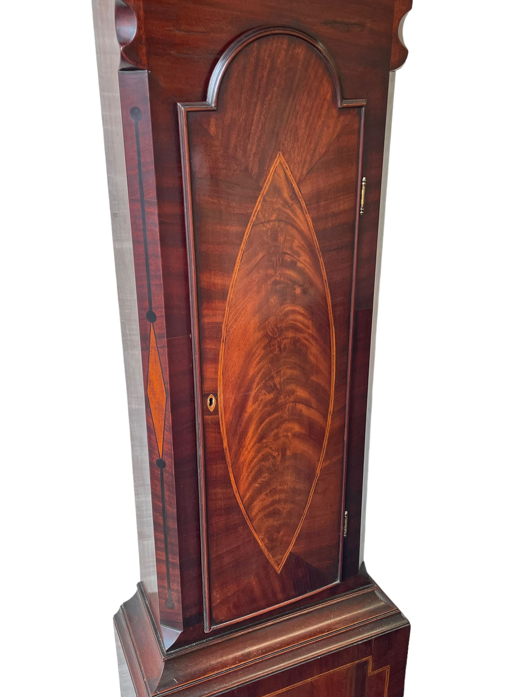 John Bancroft of Scarborough - a fine late George III 8-day mahogany longcase clock, with an elaborate pagoda pediment, brass ball and eagle finials and oval conch shell inlay, break arch hood door flanked by reeded pilasters with brass Corinthian capitals, trunk with inlaid canted corners and a break arch trunk door with 