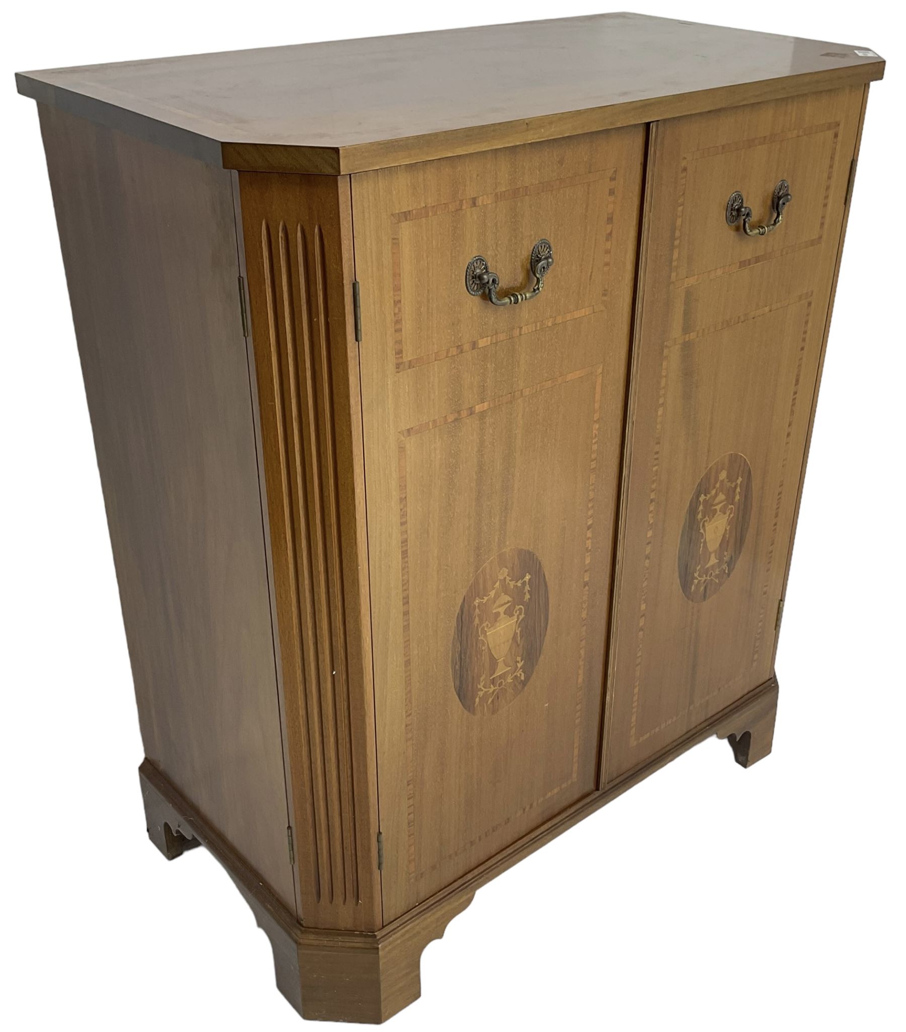 John More of Scarborough -  Edwardian Revival 'Canterbury Cabinet' inlaid mahogany cabinet, fitted with double cupboard decorated with urn motif inlays and banding, flanked by canted fluted uprights, on bracket feet