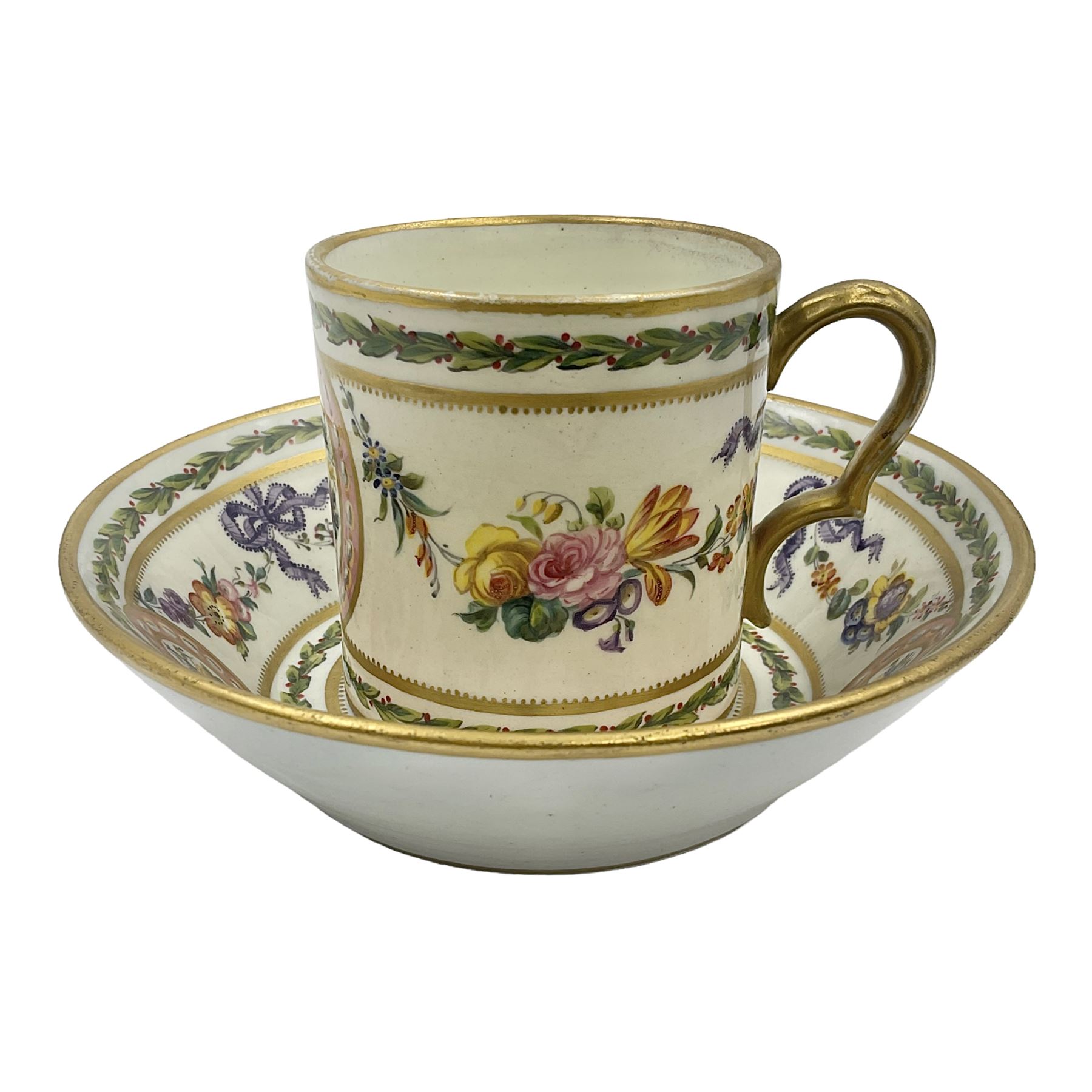 Sèvres soft paste porcelain coffee can and saucer with date code for 1780, painted with pink oval panels bordering bouquets of flowers, united by swags of flowers tied with purple ribbons, within laurel leaf borders, interlaced LL monogram enclosing date letters CC above painters marks for Nicquet, coffee can H7.5cm, saucer D15cm