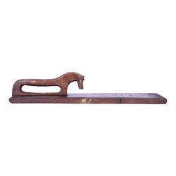 Mid 19th century Norwegian carved mangle board, dated 1856, of rectangular form with stepped edges, and carved dala horse handle, L63cm