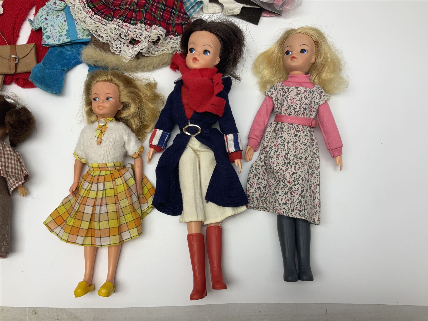 Six fashion dolls by Amanda Jane, Sindy and Barbie with various outfits, clothing and footwear