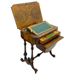 Victorian figured walnut lady's sewing or writing table, canted and curved rectangular form, the figured top enclosing pen rest with ink bottle divisions and adjustable hinged writing surface with leather inset, the frieze drawer fitted with various compartments, sliding storage well beneath, inlaid throughout with foliate motifs in boxwood, quadruple turned pillar supports on splayed feet with block terminals, united by turned stretcher 
