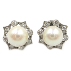  Pair of 18ct white gold pearl and diamond rim set ear-rings stamped 750  