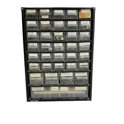 35 draw container of miscellaneous watch and clock parts including watch screws, balance wheels, barrel bushes, pocket watch springs, pocket and wrist watch mainsprings, fusee chains, and long case hands.