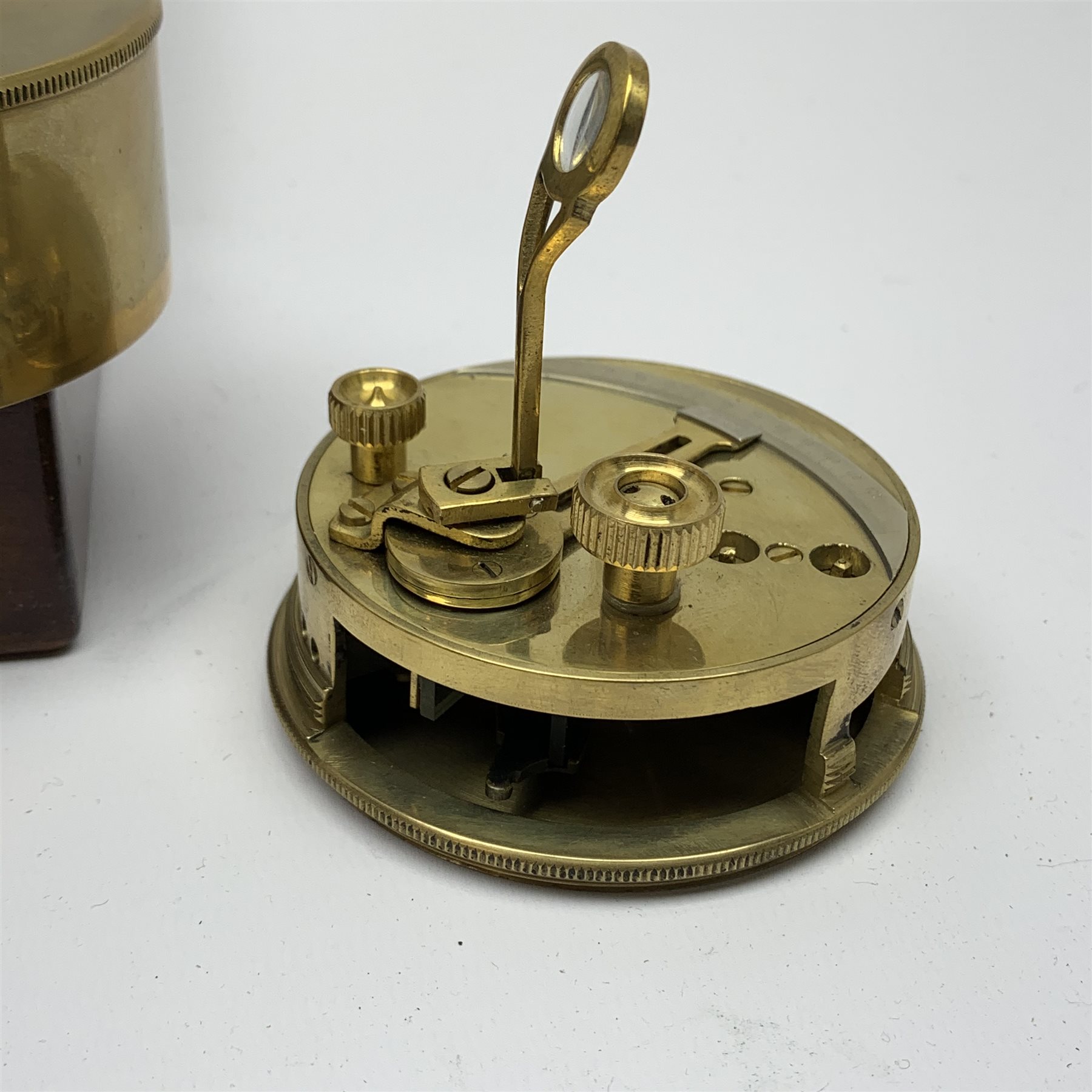 Brass Natural Sine type compass with spirit levels to the dial, bears name of Stanley, D8cm, in earlier mahogany box; brass pocket sextant of drum shaped form, the screw top marked Stanley London; small brass cased compass with pedestal tripod base; and Glass Developments Ltd. hahogany and brass spirit level L31cm (4)