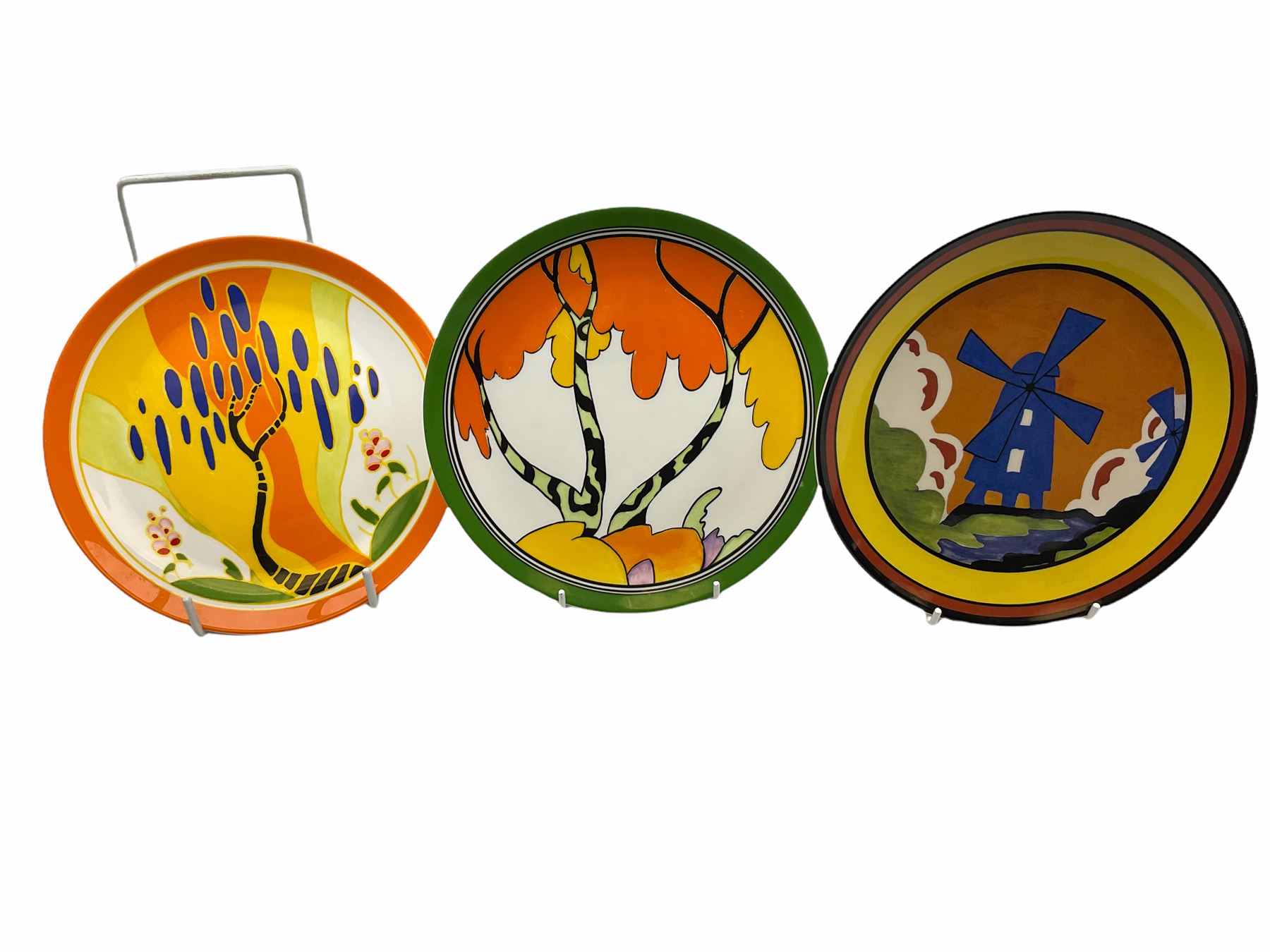 Seven limited edition Wedgwood Clarice Cliff plates, comprising Orange Roof Cottage, Caravan, Windmill, Windbells, Summerhouse, Honolulu and Bridgewater D20.5cm. 
