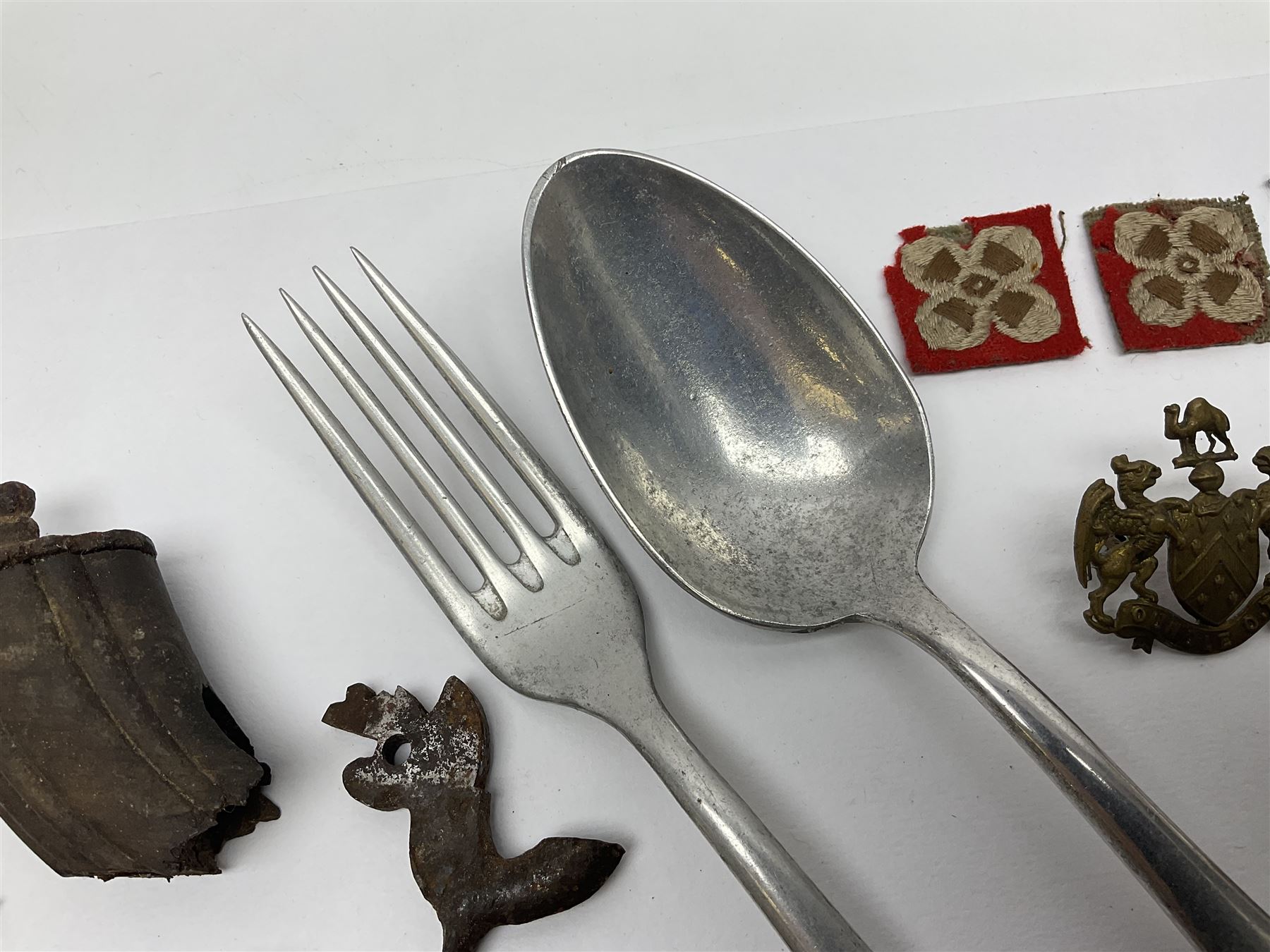 WW2 German Luftwaffe Mess cutlery comprising table spoon and fork, each with H.M.Z.38 mark; WW1 British War Medal awarded to L-13858 Gnr. J. McCabe R.A.; and small quantity of military badges, rank pips etc