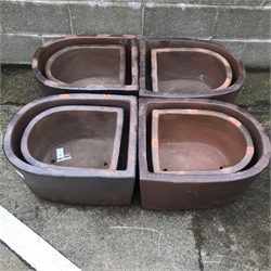  Four large 'D' shaped rustic frost proof pots (W51cm, H33cm, D61cm), four similar medium 'D' shaped frost proof pots (W42cm, H26cm, D46cm) (8)  