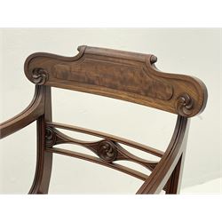 Regency mahogany elbow chair, shaped cresting rail over pierced middle rail carved with stylised flower heads, moulded sweeping arms with scroll terminals, turned and reeded supports 